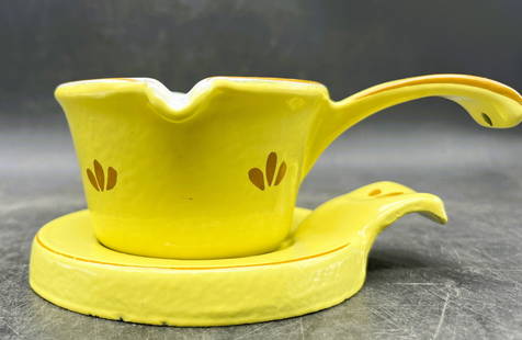 Vintage Enamel over Cast Iron Butter Warmer & Trivet Holland: Title: Vintage Enamel over Cast Iron Butter Warmer & Trivet Holland Date/Period: unknown Dimension: Approx. pot 2" tall x 5.5 x 3.75" trivet 5.25" x 4.25" Material: cast iron, enamel Additional Inform