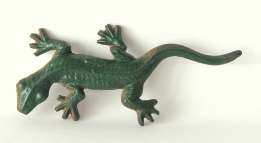 Antique cast iron lizard paper weight.