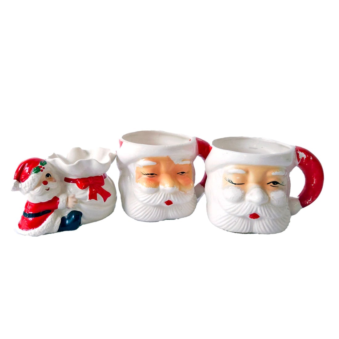 Ceramic Santa Mugs and Fitz & Floyd Candle Holder: Title: Ceramic Santa Mugs and Fitz & Floyd Candle Holder Description: Ceramic Santa Mugs and Fitz & Floyd Candle Holder Mugs measure 2.75x4” dia. Hand painted so each one is slightly different 1