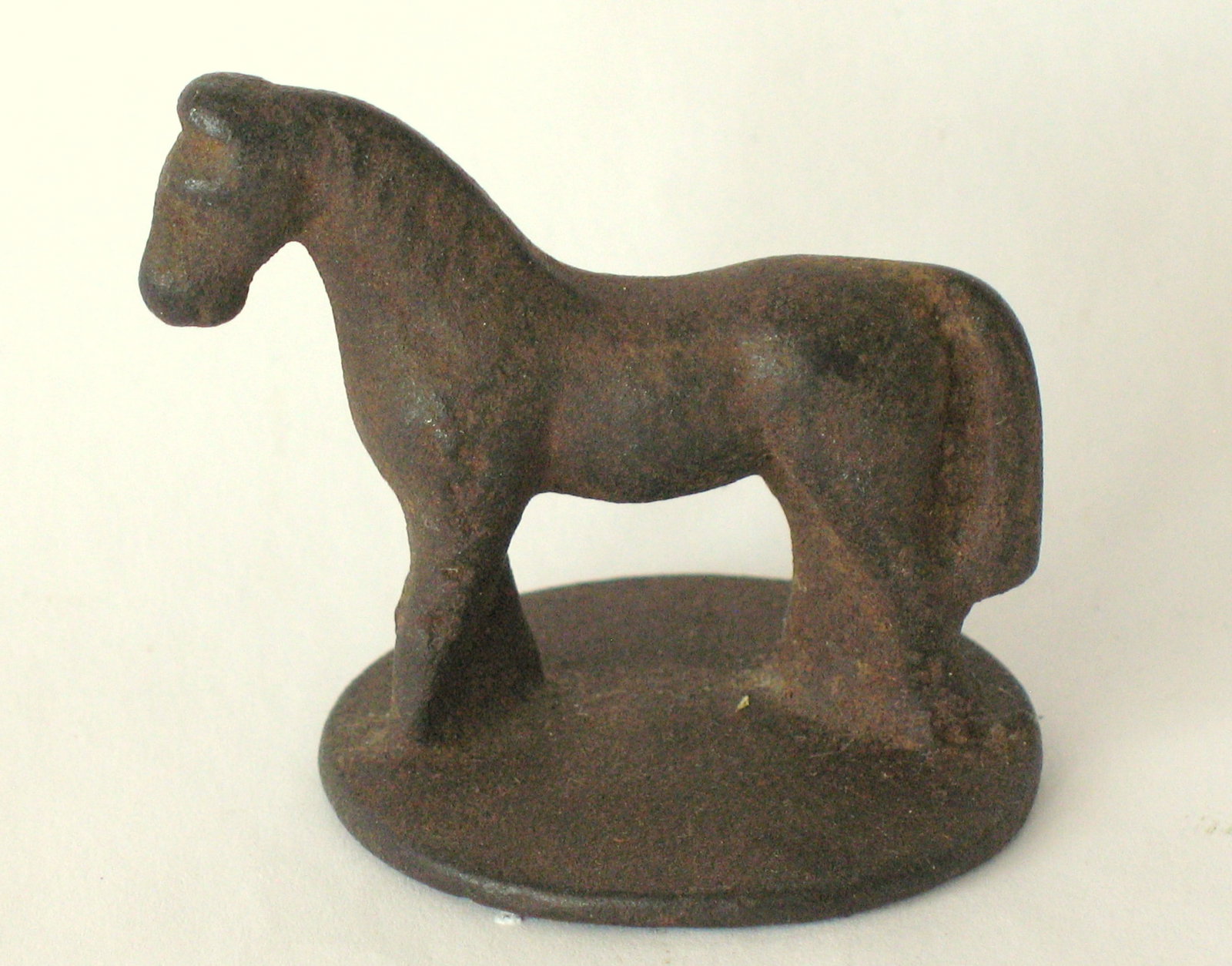 Antique cast iron horse paper weight.: Title: Antique cast iron horse paper weight. Date/Period: 1920's Dimension: 2” x 2” Additional Information: Nice antique cast iron horse paper weight in old patina & condition. Shipping: D