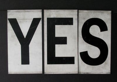 Antique tin movie marque letters “YES”.