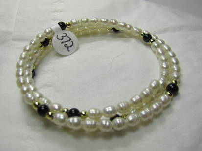 Vintage Freshwater Pearl & Lapis Lazuli Coiled Bracelet: Vintage Freshwater Pearl & Lapis Lazuli Coiled Bracelet, Appx. 3mm wide freshwater pearls. Fits up to 7 .5" wrist easily. The coil allows it to adjust easily with movement around the wrist. Not signed