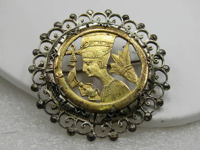 Vintage .800 Silver Egyptian Brooch/Pendant, 1-7/8", Mid-Century: Vintage Egyptian pin or pendant with a cut out image of a pharaoh and other symbols. 1 7/8", slightly domed. The center piece is prong set iin a beaded scrolled frame. It has both a pin back and a bai