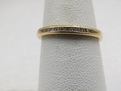 Vintage 14kt Diamond Wedding Band, Sz. 6.75, Signed R: Vintage 14kt Diamond Wedding Band, Sz. 6.75, Signed R inside a diamond outline. The ring is marked 14kt and tested, weight is 2.20 gr. There are 11 channel set round cut diamonds set across the top of