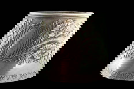 Silver napkin ring in the shape of a fist and embossed with floral motifs, surrounding a monogram: Description: Silver napkin ring in the shape of a fist and embossed with floral motifs surrounding a monogram card. Metal: Silver. Origin: Portuguese. Brand: Javali II Title. Weight: 19.8 grams | 0.7