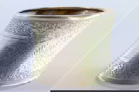 Silver napkin ring with engraved floral motifs surrounding a monogram card: Description: Silver napkin ring with engraved floral motifs surrounding a monogram card. Metal: Silver. Origin: Portuguese. Brand: Javali II Title. Weight: 24.86 grams | 0.88 ounces. Dimensions: 5.2x4