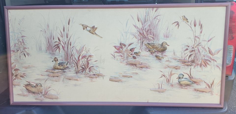 Rare Mid-Century relief painting on silk with beautiful three-dimension nature images in a wetland.: This painting depicts a tranquil wetland scene. The artwork showcases various waterfowl, including ducks and a pheasant, amidst tall grasses and lily pads. The color palette is muted, with shades of g