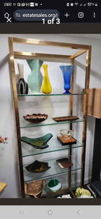 Rare tall elegant vintage mid-century modern brass and glass etagere in excellent condition: Rare tall elegant vintage mid-century modern brass and glass etagere in excellent condition Shipping: Domestic: Shipping rates are determined by destination International: Foreign shipping rates are d