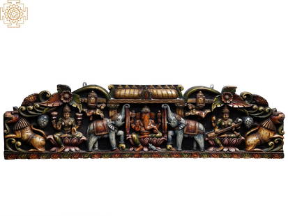 48" Large Wooden Wall Panel of Gaja Ganesha with Lakshmi and Saraswati: Title: 48" Large Wooden Wall Panel of Gaja Ganesha with Lakshmi and Saraswati Description: Wood Height: 13 inch Width: 48 inch Depth: 2 inch Weight: 8.68 kg Additional Information: Carved like a minia