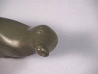 Inuit Native American Soapstone Carving Seal Vintage Figurine: This is a vintage Primitive Native American Eskimo Inuit Seal/Walrus Figurine. The figurine is made from gray soapstone and is very beautiful. It is app. 2 1/4" tall and 8 " long. It is in good vintag