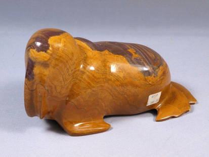 Vintage Inuit Eskimo Native American Carving Orange Walrus Granite Marble: This is a vintage carving a walrus. It is made from unusual orange brown stone, probably granite. The carving is app. 7" by 4" at the base and 3" tall. It has its original price tag - $585. It is insi