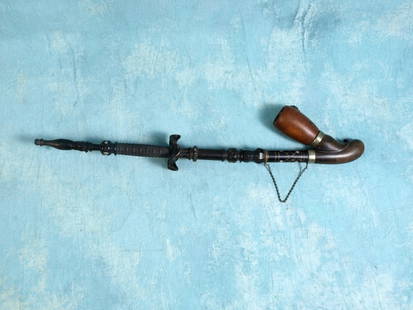 Extra-long 18" Carved mother of pearl Ebony Antique Stone jewel Smoking pipe: This is a unique one of a kind long steam carved wood pipe. The pipe is handmade, ebony carved with inlay of mother of pearl. There is a jewel stone inlaid in the decoration on the front of the bowl.