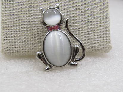 Vintage White Moonstone Cat Brooch, 1.5" by 1".: Vintage White Moonstone Cat Brooch, 1.5" by 1", 1960's-1980's. Silver tone with a white round and oval moonstone that is appx. 8mm round for the face and 16mm by 12mm for the body. Pink enameled glitt