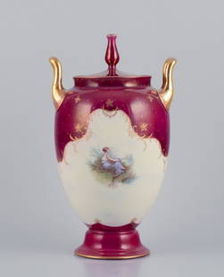 Rosenthal and Wien. Early lidded porcelain vase with two handles. Classic form. Hand-painted at the: Rosenthal and Wien. Early lidded porcelain vase with two handles. Classic form. Hand-painted at the porcelain factory in Wien. Gold decoration. Burgundy-colored. Early 1900s. Marked. Perfect condition