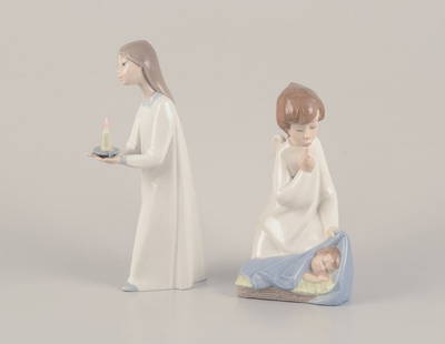 Lladro, Spain. Two porcelain figurines. Girl with a nightstand lamp and an angel figurine with a: Lladro, Spain. Two porcelain figurines. Girl with a nightstand lamp and an angel figurine with a sleeping child. Approximately from the 1980s. Marked. Perfect condition. Sticker. Girl with lamp: Heigh