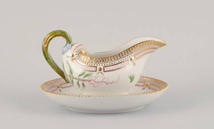 Royal Copenhagen Flora Danica sauce boat on a pedestal with a leaf-shaped handle.