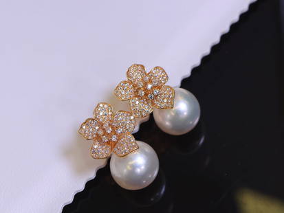 S925 sterling silver camellia pearl earrings: S925 sterling silver camellia pearl earrings. Zircon inlay natural freshwater pearls 12～11mm Reserve: $250.00 Shipping: Domestic: Shipping rates are determined by destination International: For