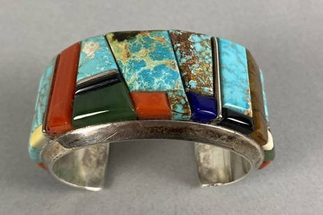 Stunning Navajo Sterling Silver Cuff Bracelet With Inlaid Stones By Wes Willie: The bracelet is in excellent condition. The weight of the piece is shown in the last picture. The stones appear to be turquoise, coral, lapis lazuli, and possibly other materials such as sugilite and