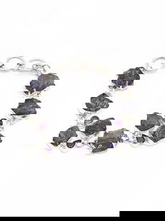 Rugged Tanzanite Toggle Clasp Lock Bracelet with Faceted Amethyst: Title:Rugged Tanzanite Toggle Clasp Lock Bracelet with Faceted Amethyst Description:Specifications JA66 Sterling Silver Dimensions: 1 inch Height x 7.5 inch Length Weight: 28 gm Reserve: $150.30