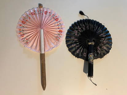 Two Pull Out Hand Fans: Title: Two Pull Out Hand Fans Description:Two interesting turn-of-the-century hand fans. The first pull out fan is cased in a paper cigar. When pulled, a poppy decorated pink cotton circular fan emerg