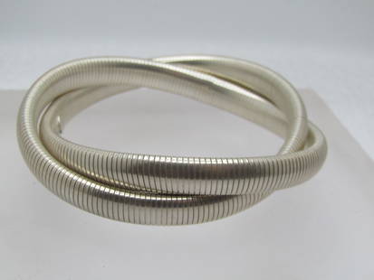 Vintage Sterling Double Twist Omega Bangle Bracelets, 6.75" , 1990's, Signed: Vintage Sterling Silver Intertwined Omega Bangle Bracelets, 6.75" , 1990's, Unisex, Signed S in a square frame. They are appx. 7.5mm wide. They have a little stretch to them and can fit a 7.5"