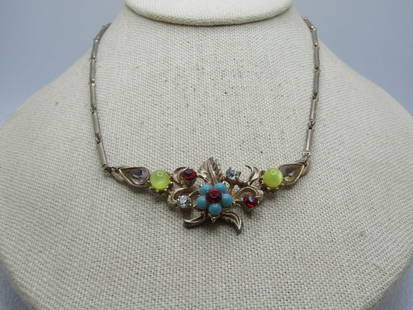 Vintage Rhinestone Floral Necklace, V-Drop, 1950's, 16": Vintage Rhinestone Floral Necklace, V-Drop, 1950's, 16". Gold tone bar link chain with flip clasp. The front drop is appx. 2-5/8" wide with a 2" drop at the front center. It has a faux turquoise bloss