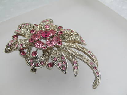 Pink Rhinestone Faux Marcasite Floral Brooch, 2.75": Pink Rhinestone Faux Marcasite Floral Brooch, 2.75" by 2". A cluster of mixed sized round cut pink stones, some lighter/some darker in the center and smaller ones scattered around the brooch with