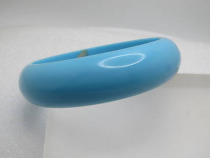 Vintage Aqua Plastic Bangle Bracelet, 8", 1960's-1970's: Vintage Aqua Plastic Bangle Bracelet, 8", 1960's-1970's. It is 3/4" wide and domed around the outer edge. It has an opening of appx. 2.75" which allows it to fit larger wrists and slip over the