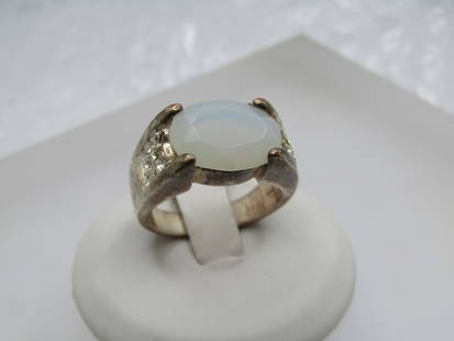 Vintage Silver Plated Faux Opal CZ Ring, Sz. 8.5. 1980's-1990's: Vintage Silver Plated Faux Opal CZ Ring, Sz. 8.5. 1980's-1990's. It has an oval glass stone with the faint look of opal. Chunky faceted stone that is appx. 13mm by 10mm. It has pave-set clear stones o