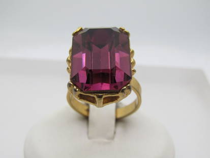 Vintage Faux Amethyst Statement Ring, Adjustable, 1960's-1970's: Vintage Faux Amethyst Statement Ring, Adjustable, 1960's-1970's. Gold tone setting with a rectangular faux amethyst glass rhinestone that is appx. 18mm by 12.5m - angled corners. It sits up on the fin