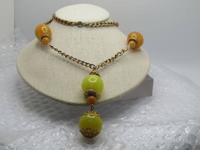 Vintage Yellow/Orange Beaded Drop Necklace, 30", 1960's: Vintage Yellow/Orange Beaded Drop Necklace, 30", 1960's. Heavy textured gold tone curb link chain that is appx. 6mm wide with chunky oval beads. Plastic and appx. 1.25" tall and 8mm round . The orange