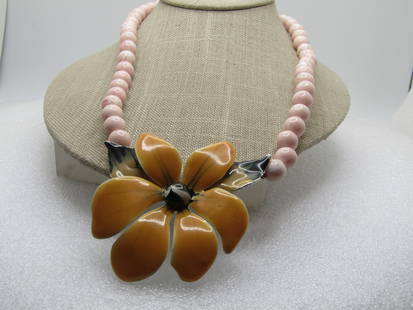 Vintage Enameled Blossom & Beaded Necklace,  21", 1970". silver tone lobster clasp.  The back of the: Vintage Enameled Blossom & Beaded Necklace, 21", 1970". this has a enameled golden and black and white accented blsosom on the front as the pendant with six petals and two leaves. The blossom is yello