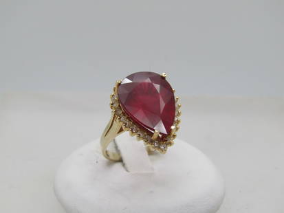 Vintage 14KT Ruby & Diamond Halo Ring, Size 6.5, 9.5 CTW, Pear Cut: Vintage 14KT Ruby & Diamond Halo Ring, Size 6.5, 9.5 CTW, Pear Cut. 14kt yellow gold that tests as gold with an appx. weight of 6.58 gr. Large deep red pear-shaped ruby that is appx. 9.5 ctw. It is ap