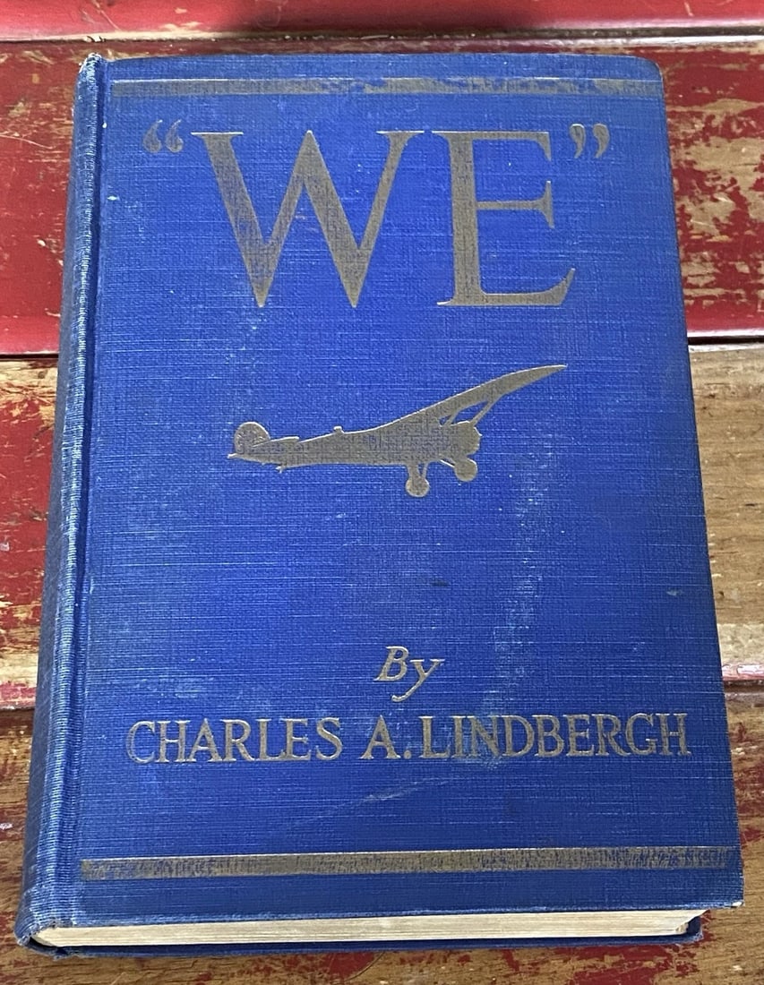 WE by Charles A. Lindbergh 1927 1st Ed. 25th Impression Illustrated HC: Experience the captivating narrative of "WE" by Charles A. Lindbergh, published in 1927 by G.P. Putnam's Sons. This 25th impression showcases the adventurer's thrilling account of his famous transatla
