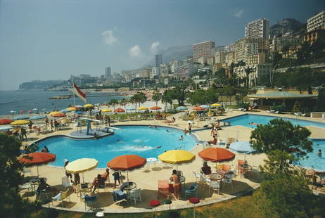 Monte Carlo Beach Club ' By Slim Aarons Oversized C Type: Description ' Monte Carlo Beach Club ' by Slim Aarons Guests around the pool at the Monte Carlo Beach Club, Monaco, August 1970. (Photo by Slim Aarons/Hulton Archive/Getty Images) Paper size 40 x 60 i