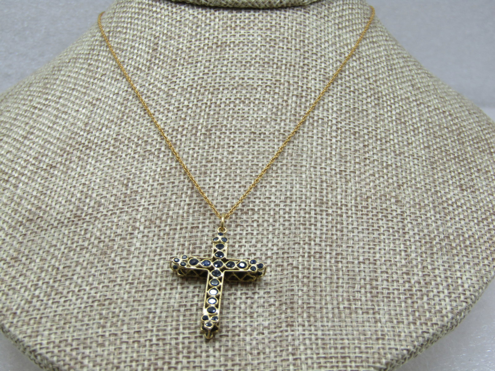 Vintage 18kt Sapphire Cross Necklace, 18" 10kt Chain Signed: Vintage 18kt Sapphire Cross Necklace, 18" 10kt Chain Signed Speidel on the chain. The pendant is appx. 1.5" tall, including bail and 1" wide. It is appx. 1/4" thick. It is a lattic design with dark bl