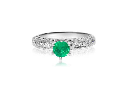 1.00 Carat Diamond & Colombian Emerald Ring in 14K Gold: 14k white gold. 0.50 carat diamonds. VS clarity and G color. 0.50 carat emerald. 100% genuine earth mined Colombian Emerald. All stones are 100% natural earth mined precious stones. TCW of all preciou