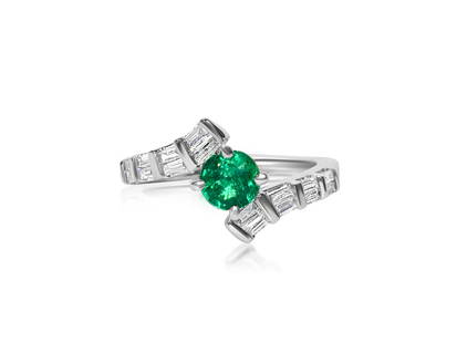 1.70 Carat Diamond & Colombian Emerald Ring in 14K Gold.: 14K white gold. 1.00 carat diamond. VS clarity and G color. Baguette cut diamonds. 0.70 carat Colombian Emerald, round cut. All stones are 100% natural earth mined. TCW of all stones: 1.70 carat. Extr