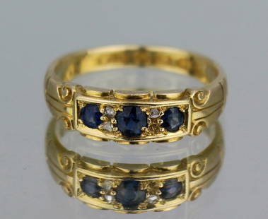 Antique Sapphire & Diamond 18ct Gold Ring: Antique Sapphire & Diamond 18ct Gold Ring Description: This antique ring, dating back to the Victorian era, showcases a trio of sapphires set alongside small diamonds, all beautifully arranged in an 1