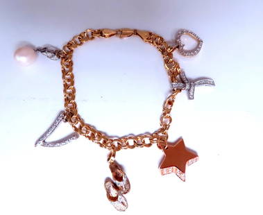 Caribbean keepsake natural diamonds charm bracelet 14Kt gold 12457: Title Caribbean keepsake natural diamonds charm bracelet 14Kt gold 12457 $3,000.00 PRODUCT DESCRIPTION Natural diamonds charms bracelet 6 charms: heart: 14 x 14 mm cross: 21 x 14 mm star: 17 x 17 mm f