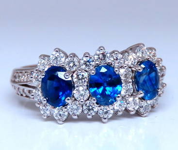1.25ct Natural Sapphires Diamonds Ring 14kt Gold Three stone style: MAGNIFICENT JEWELS Classic Diamond & Sapphires 3 Cluster ring 1.25ct Sapphires (Heated) Oval Full Cut Brilliant .70ct natural diamonds G-color Vs-2 Clarity 9.2mm diameter Depth of ring: 5.4mm current