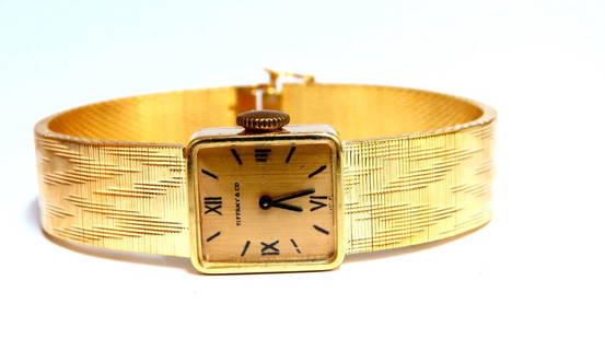 Tiffany & Co Vintage Gold Watch 18kt 6.5 inch: MAGNIFICENT JEWELS Tiffany & Co Vintage Watch is in working condition good condition overall gorgeous band deco casing of watch is: 14mm x 16mm 52 grams marked "18kt" on case. 6.50 inch. Free Insured