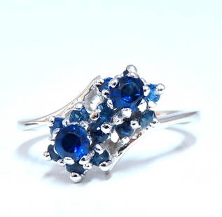 .50ct natural sapphire double cluster ring 14kt: Natural sapphire cocktail bypass ring. . 50ct. Natural round blue sapphires. Vivid Royal blue, clean clarity and transparent 14 karat white gold 3.5 grams 12 mm wide deck Depth of ring 7 mm Size 6.75