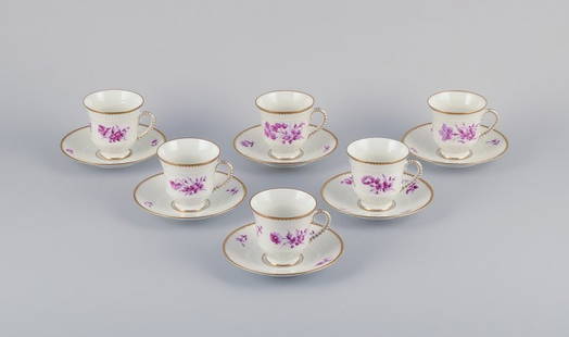 Bing & Grøndahl, Denmark. A set of six coffee cups and saucers with flower decorations in: Bing & Grøndahl, Denmark. A set of six coffee cups and saucers with flower decorations in purple and gold trim. Hand-painted. Approximately 1920s. Marked. In perfect condition. Appears unused. Fi