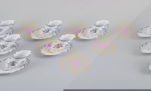 Bing & Grøndahl, Denmark. A set of six demitasse cups with saucers decorated with floral motifs: Bing & Grøndahl, Denmark. A set of six demitasse cups with saucers decorated with floral motifs in purple and gold trim. Hand-painted. Approximately from the 1920s. Marked. In perfect condition.