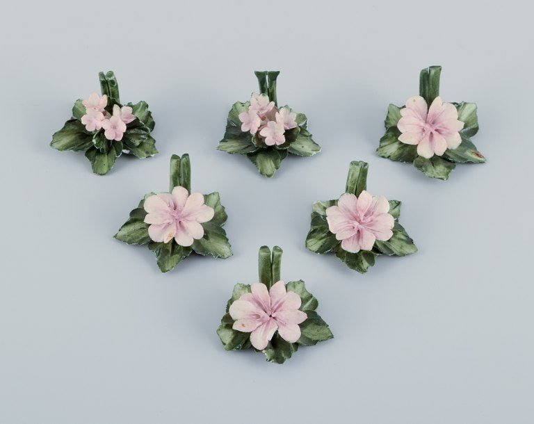 Capodimonte, Italy, a set of six porcelain table card holders shaped like water lilies.: Capodimonte, Italy, a set of six porcelain table card holders shaped like water lilies. Hand-decorated. Overglaze finish. Mid-20th century. Marked. In excellent condition with minor insignificant chip