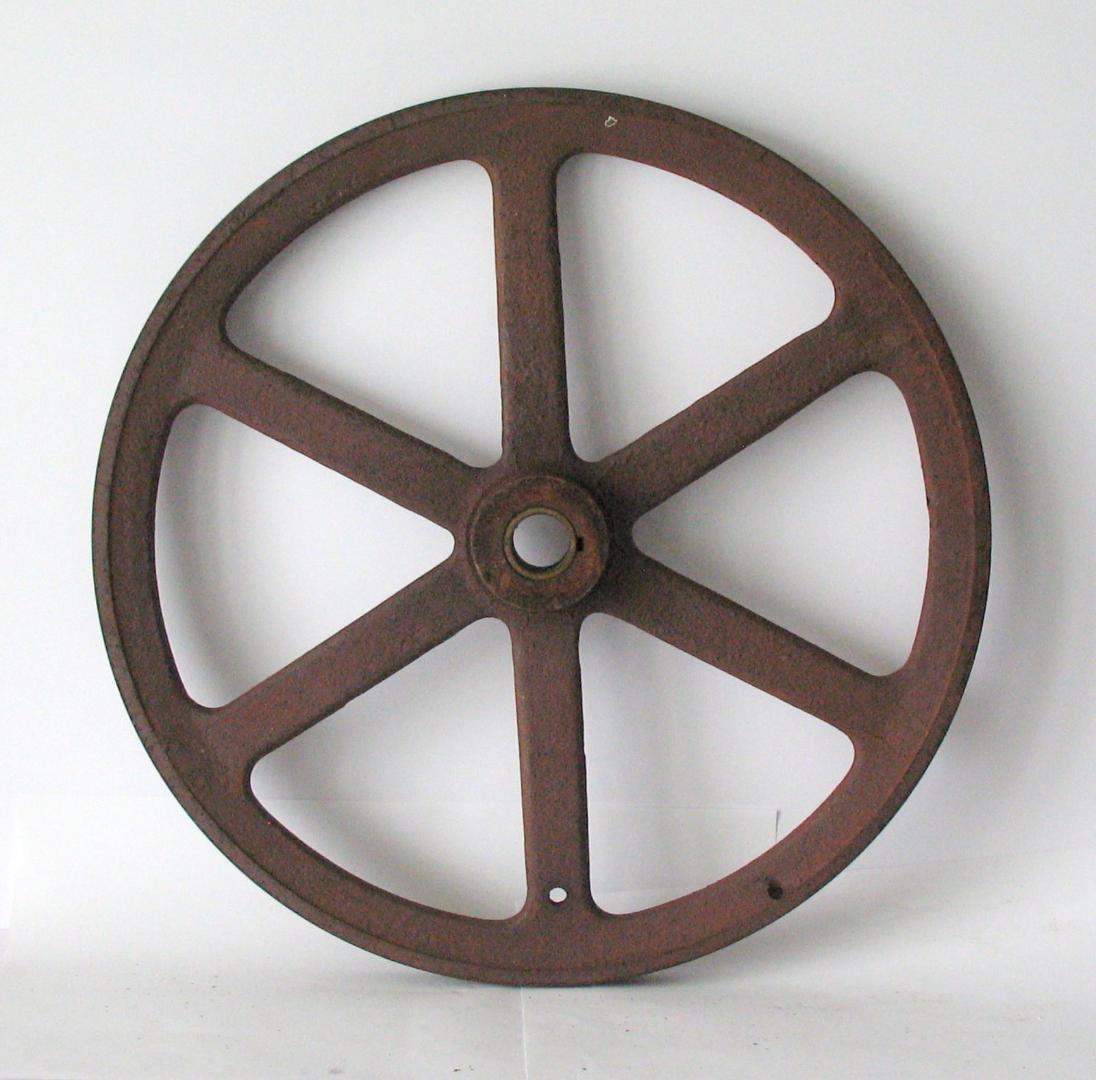 Antique cast iron industrial machinery pulley.: Title: Antique cast iron industrial machinery pulley. Date/Period: 1930's Dimension: 16” diameter Additional Information: Antique cast iron industrial machinery pulley in all original patina & c