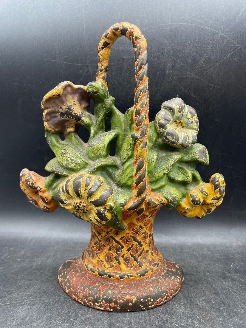 Antique Cast Iron Doorstop Flower Basket: Title: Antique Cast Iron Doorstop Flower Basket Date/Period: Approx 1930's Dimension: Approx. 9.5" tall Material: cast iron Additional Information: Antique Cast Iron Doorstop Flower Basket, likely Hub