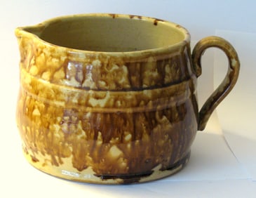 Antique yellow ware batter pitcher.