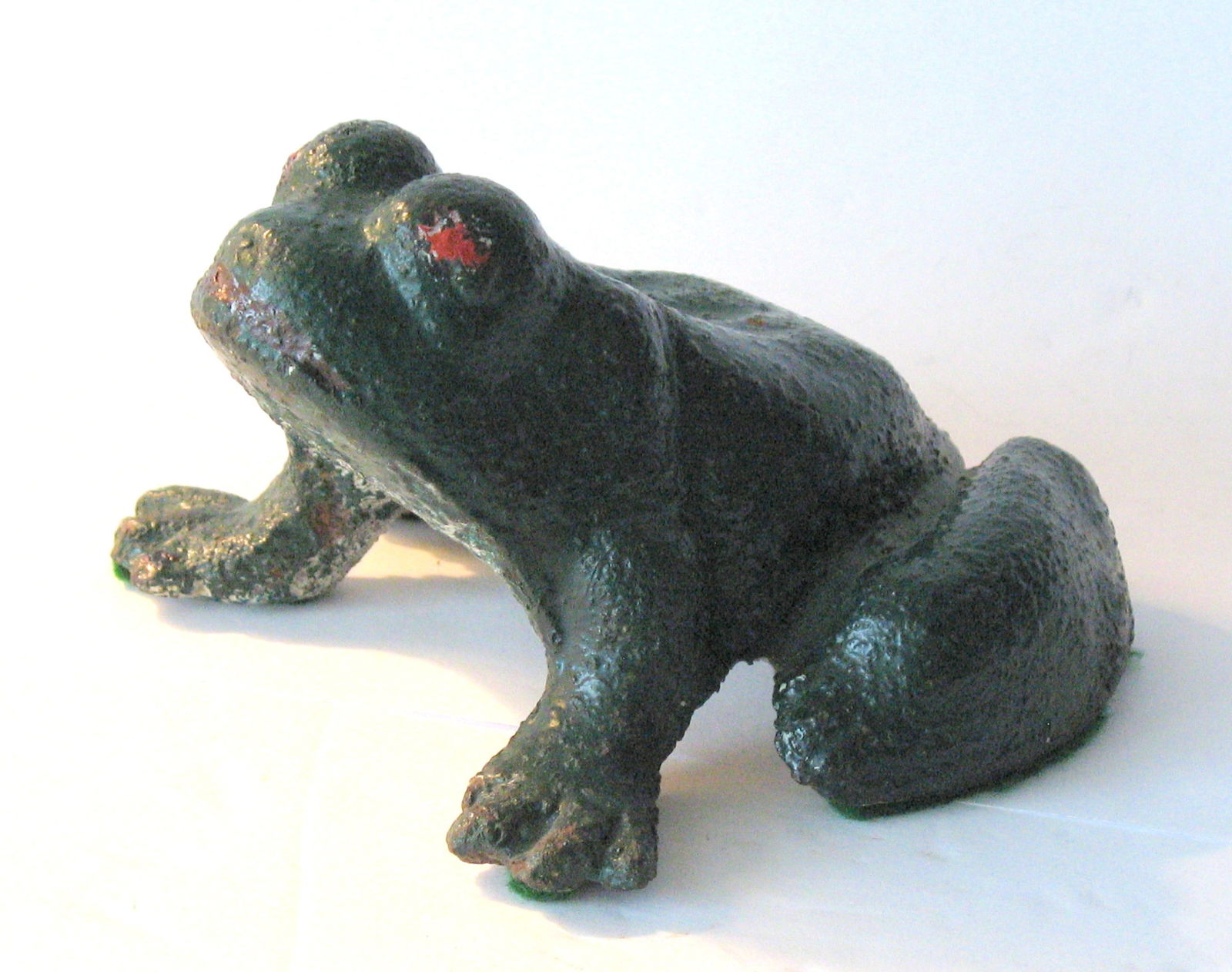 Antique cast iron frog door stop.: Title: Antique cast iron frog door stop. Date/Period: 1930's Dimension: 5” long Additional Information: Nice antique cast iron frog door stop in original paint, patina & condition. Shipping: Dom